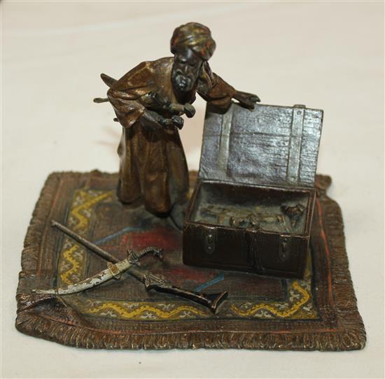 An Austrian cold painted bronze group of an Arab weapons seller, 4.75in.